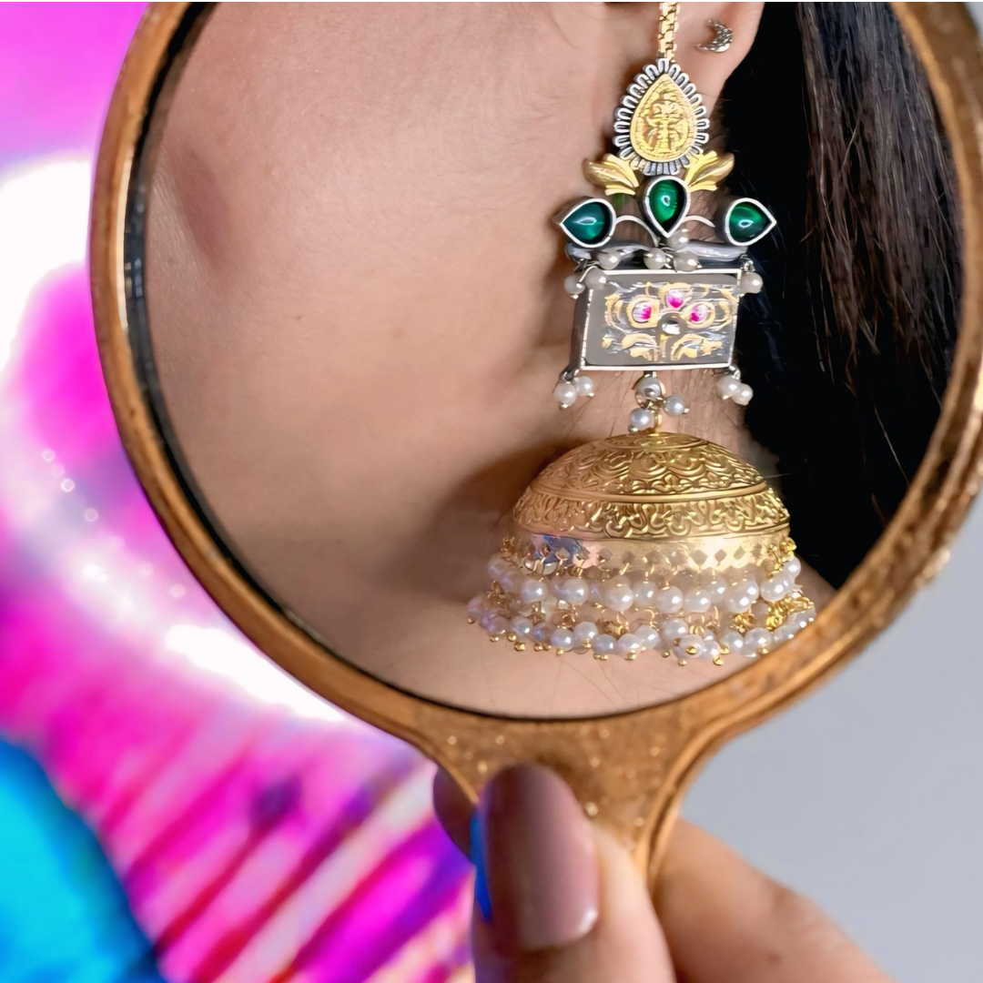 Jhumka with Gold, green, and silver hues.