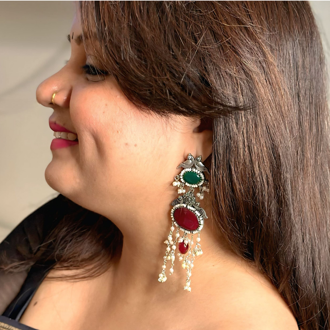 Elegant oxidized chandelier earrings adorned with vibrant gemstones and delicate pearl drops
