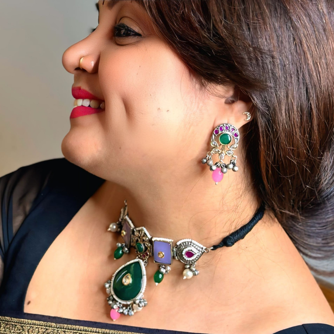 Exquisite oxidized choker set with vibrant gemstones, intricate detailing.