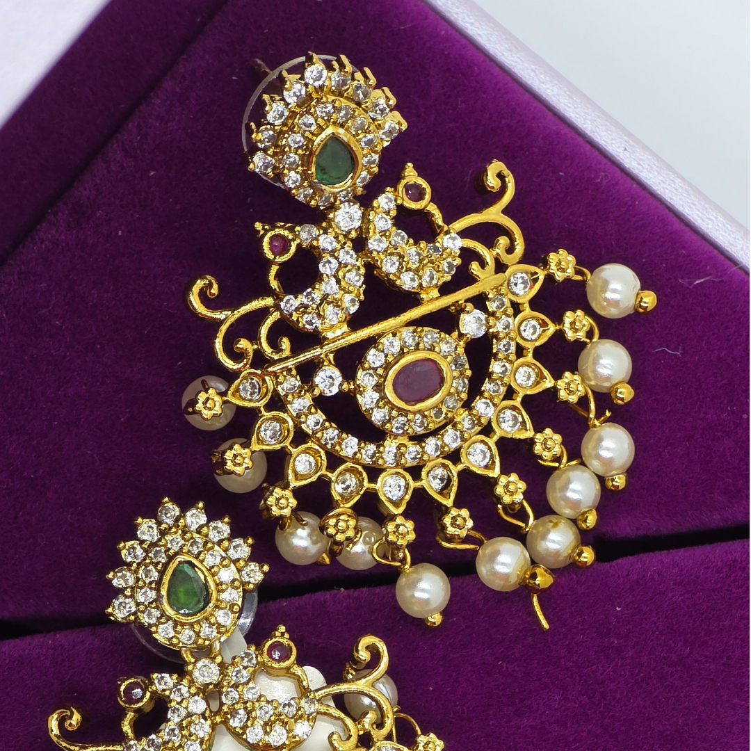 Traditional gold-toned earrings adorned with Pearls & CZ stones